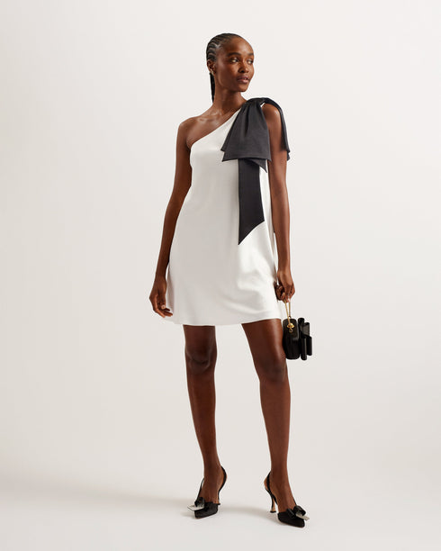 MIDORI-Dresses-Introducing the perfect party look. Featuring a one-shoulder design that's topped with an oversized bow, this satin mini dress exudes glamor. The A-line shift silhouette not only looks elegant, but it also leaves you room to get down on the dancefloor. Pair it with your favorite heels and you have a look that's perfect for the occasion. Mini dress One shoulder design Oversize bow embellishment Satin finish A-line shift silhouette Concealed side zip fastening Lydia is 5'10" / 1.77m and wears